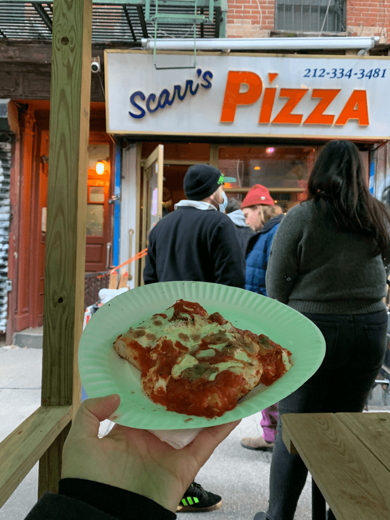 slice of pizza outside of Scarr’s pizza